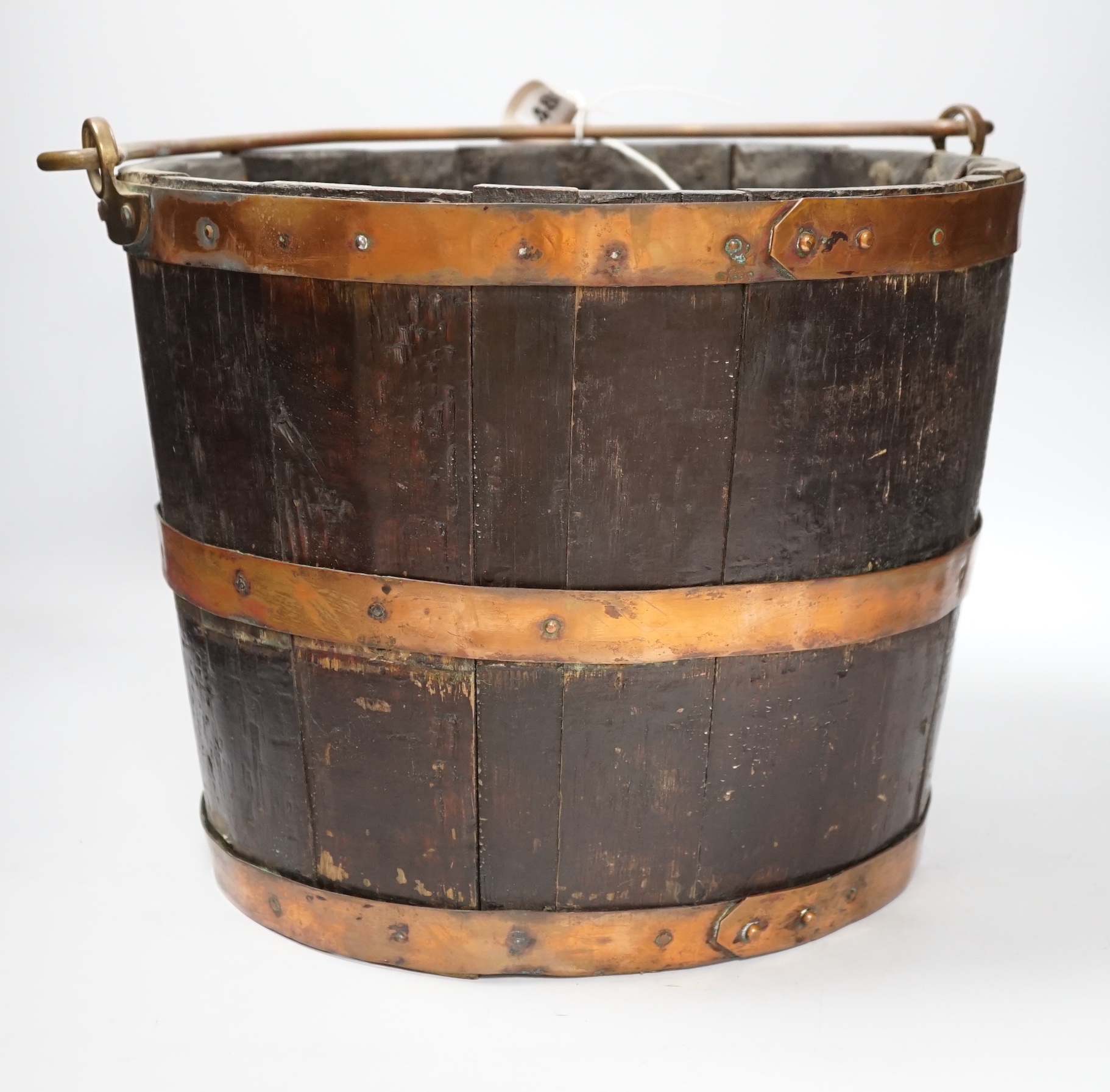 A copper bound oak bucket, 35cm diameter